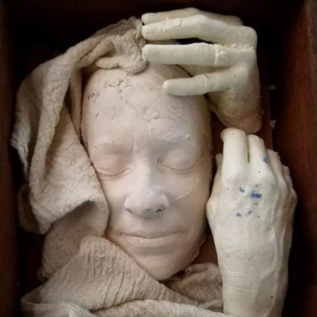 Detail of a plaster cast face sculpture